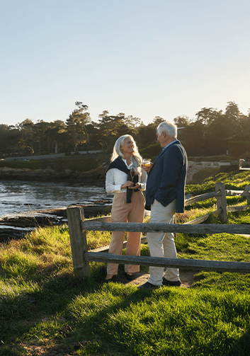 A man and woman drinking wine in Pebble Beach