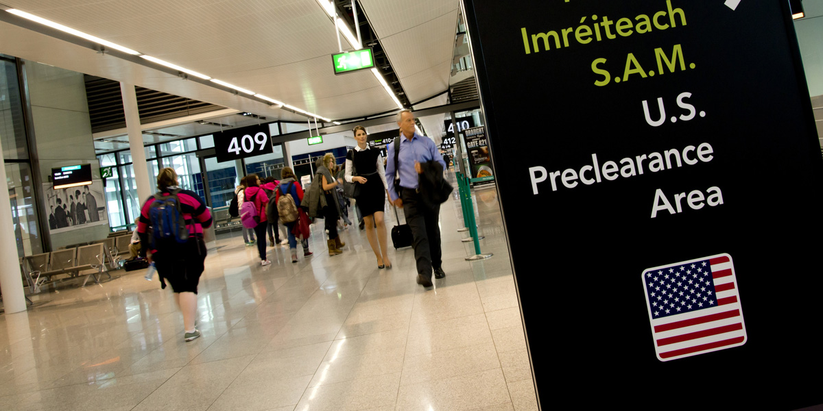 Passengers rush through customs after an Aer Lingus flight