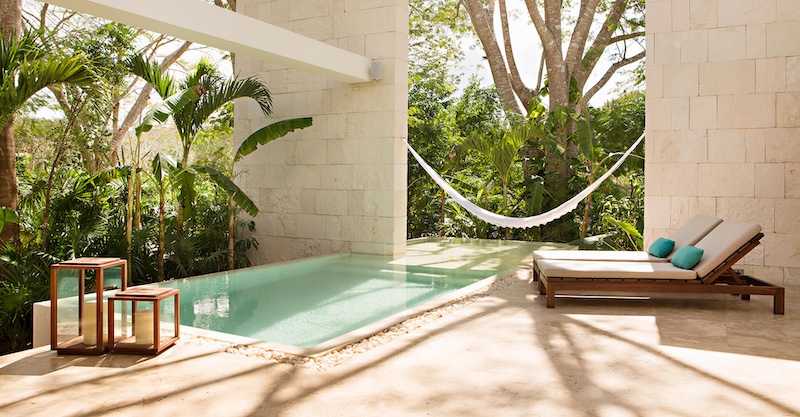 Private patio with pool, hammock, lush foliage